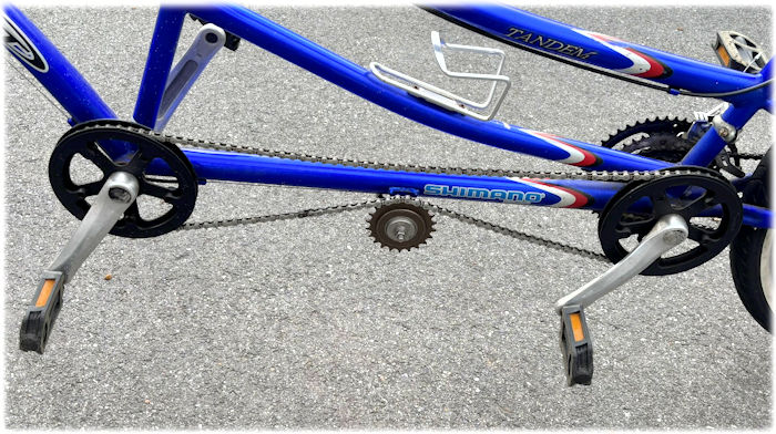Idler in tandem synchronizing chain