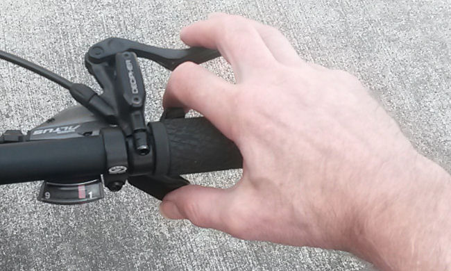 integrated shifter for flat bars. Braking is possible while upshifting and downshifting.